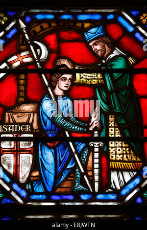 St Barth's church. Stained glass window. Blessing of crusader. Stock Photo