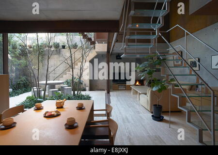 Interior of a japanese house with living room and table with a private small garden Stock Photo