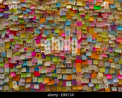 Hong Kong, China. 9th October, 2014. Messages of support for the pro-democracy protests are posted on the walls of the Tamar  government building. The wallhas become known as 'Lennon Wall' and now contains thousands of messages of support for the pro democracy protesters. Stock Photo