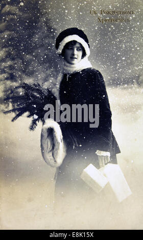 Dec. 1, 2009 - Postcard printed in Russia shows yong woman on the background of snow-capped forest, circa 1915 © Igor Golovniov/ZUMA Wire/ZUMAPRESS.com/Alamy Live News Stock Photo