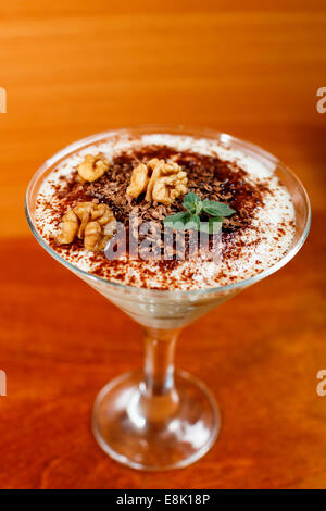 tiramisu in glass decorated by walnut Stock Photo