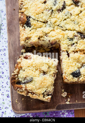 Fruit cake with streusel on wooden board, overhead Stock Photo