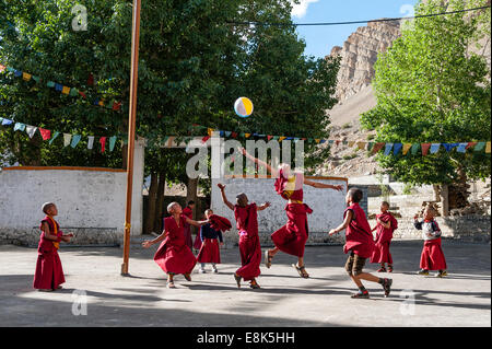 Young monks are play with ball in Key monastery Stock Photo