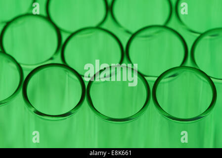 Close up of some test tubes on a green background Stock Photo