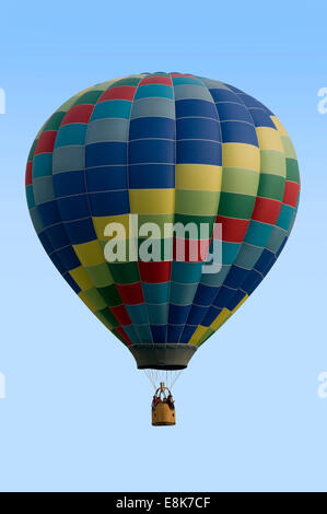 Colorful hot-air balloon against a blue sky Stock Photo