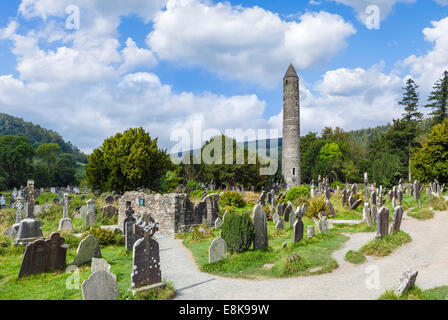 Cemetery and Round Tower in the old monastic settlement of Glendalough, County Wicklow, Republic of Ireland Stock Photo