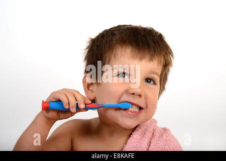 Young boy child children cleaning brushing teeth Stock Photo