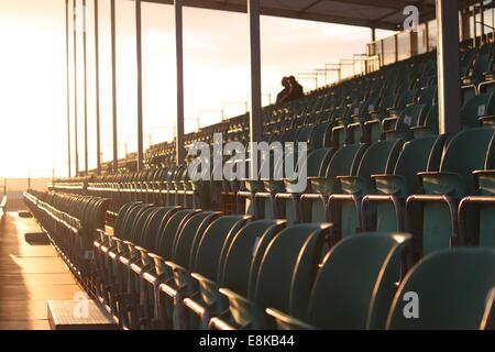 Symmetrical regular pattern grandstand seating arrangement at sunset Stock Photo