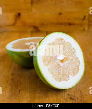 White grapefruit on wooden background Stock Photo