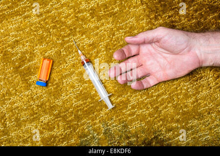 A man overdoses after injecting himself with too much of a lethal narcotic. Stock Photo