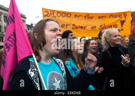 Copenhagen, Denmark. 9th October, 2014. Young woman (photo, left) shouting slogans, demanding more jobs and better education. She is part of a rally gathering thousands of young people, where the high youth unemployment rate (20%) was in focus, together with better education and housing. Credit:  OJPHOTOS/Alamy Live News Stock Photo