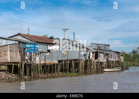 Slums built on stilts over the canals in the Mekong Delta. Stock Photo