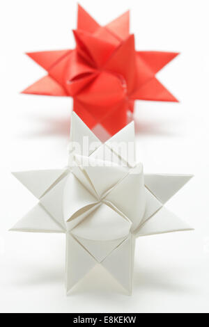 Two Origami Moravian stars folded in paper Stock Photo