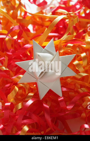 Colorful folded paper star or origami lucky star to use as frame Stock ...