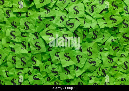 Crumpled green paper notes with dollar sign. Stock Photo