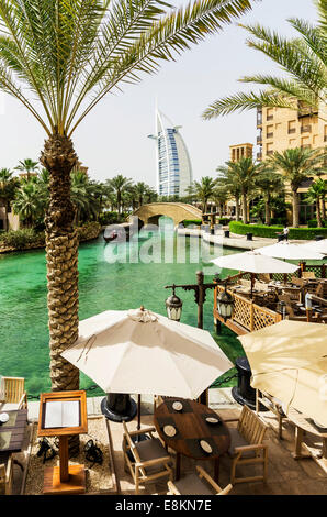Madinat Jumeirah, Arabian Resort, Burj al Arab hotel at back, Umm Suqeim 3, Dubai, United Arab Emirates Stock Photo