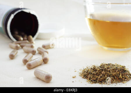 Herbal tea with  herbal pills and mixture of dried herbs Stock Photo