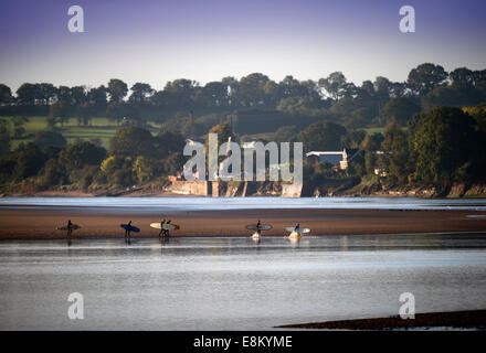 Surfers race to catch this morning's bore on the River Severn at Newnham-on-Severn near Gloucester Oct 2014 Stock Photo