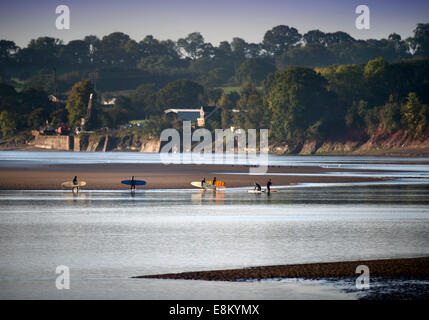 Surfers prepare to catch this morning's bore on the River Severn at Newnham-on-Severn near Gloucester Oct 2014 Stock Photo