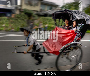 Rickshaw ride in Arashiyama, Kyoto, Japan. Stock Photo