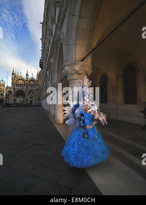 Unidentified man and woman in carnival masks on the area of the Doge of Venice Stock Photo