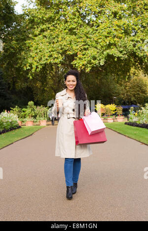 woman enjoying coffee with shopping bags Stock Photo