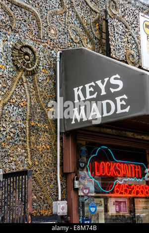 Locksmith shop in Greenwich Village, New York, with facade of metal sculpture made with keys by the owner, Phil Mortillaro. Stock Photo
