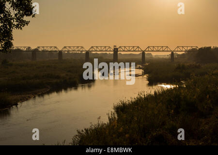 Late afternoon view of the bridge and river in front of Skukuza camp Stock Photo