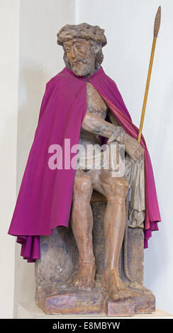 BRUGGE, BELGIUM - JUNE 12, 2014: The statue of Jesus in the bond and purple coat in Saint Walburga church. Stock Photo