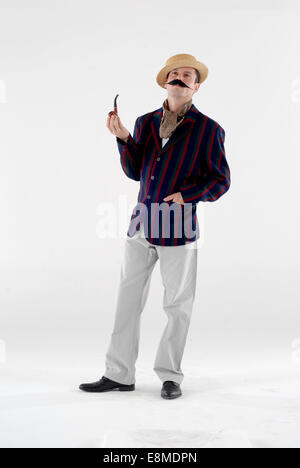 man in fancy dress comedy costume as a barber shop quartet singer with a hudsucker jacket and straw hat Stock Photo