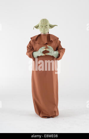 Woman in fancy dress comedy costume in a yoda outfit from starwars the science fiction film Stock Photo