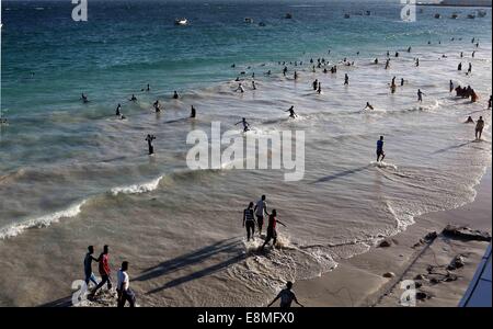 Mogadishu, Somalia. 10th Oct, 2014. Local people have fun on the beach in Mogadishu, capital of Somalia, Oct. 10, 2014. Sitting along the Indian Ocean, Somalia's capital city Mogadishu boasts beautiful beaches and abundant sunshine, which attract a large number of local residents to spend their weekends here. © Zhang Chen/Xinhua/Alamy Live News Stock Photo