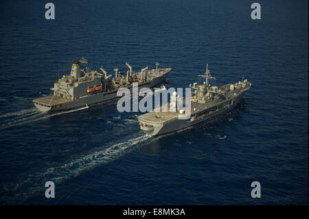 Mediterranean Sea, October 28, 2013 - The Military Sealift Command fleet replenishment oiler USNS Leroy Grumman (T-AO 195), left Stock Photo