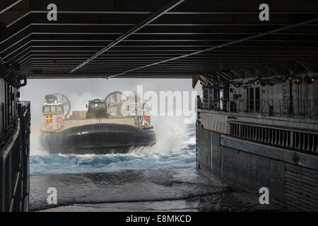 Pacific Ocean, July 14, 2014 - A landing craft air cushion (LCAC) enters the well deck of the amphibious dock landing ship USS R