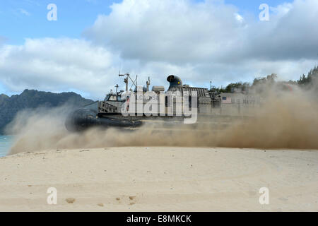 Marine Corps Training Area Bellows, Hawaii, July 27, 2014 - A landing craft air cushion (LCAC) departs for an equipment offload Stock Photo