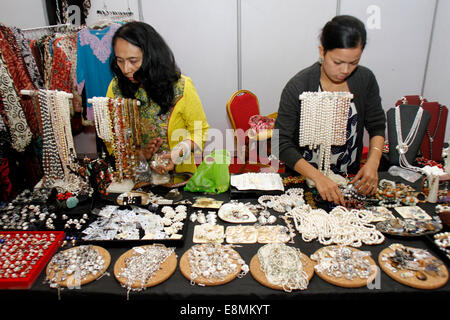 Phnom Penh, Cambodia. 11th Oct, 2014. Indonesian vendors prepare jewelry products during an Indonesian trade and tourism exhibition in Phnom Penh, Cambodia, Oct. 11, 2014. © Sovannara/Xinhua/Alamy Live News Stock Photo