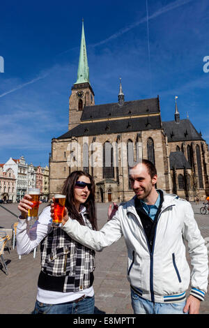 Cathedral of St. Bartholomew and pair with a beer front of it, Plzen Czech Republic Stock Photo