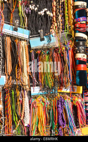 Multicoloured leather bracelets hanging on a market jewelery stall. Stock Photo