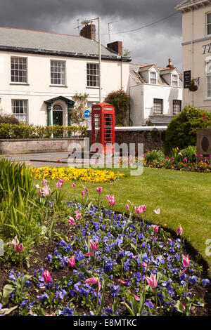 UK, England, Devon, Barnstaple The Square, old red K6 phone box amongst flower beds Stock Photo