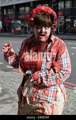 London, UK. 11 October 2014. Hundreds of scary Zombies gathered on World Zombie Day 2014 near Waterloo Station, before setting off on a trek through Central London. Credit:  Nick Savage/Alamy Live News Stock Photo