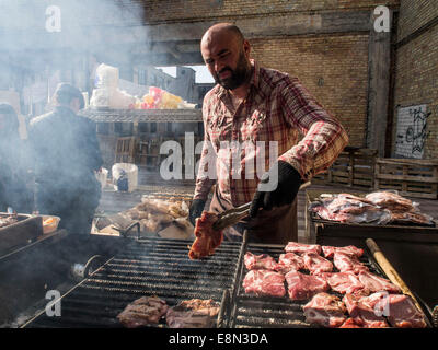 Kiev, Ukraine. 11th Oct, 2014. Street food presented traditional Ukrainian, English, Indian, Moroccan cuisine. In the menu, there is a barbecue, roasted on the fire vegetables, Thai noodles, seafood, fish, desserts, hot dogs and more. There are about 15 participants with an updated autumn menu. Credit:  Igor Golovnov/Alamy Live News Stock Photo