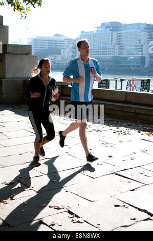 Runners on Victoria Embankment, London, UK Stock Photo