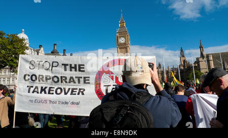Parliament Square, London UK. 11th October 2014. Demonstrations take place with Anti TTIP banners in Parliament Square on a European wide Day of Action protest against the Transatlantic Trade & Investment Partnership which wants to transfer powers to Corporations thereby destroying democratic rights of society especially the National Health Service.  Kathy deWitt/Alamy Live News Stock Photo