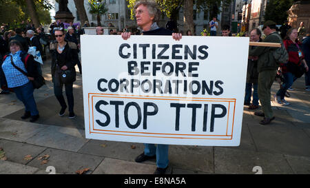 Parliament Square, London UK. 11th October 2014. Demonstrations take place with Anti TTIP placards in Parliament Square on a European wide Day of Action protest against the Transatlantic Trade & Investment Partnership which wants to transfer powers to Corporations thereby destroying democratic rights of society especially the National Health Service.  Kathy deWitt/Alamy Live News Stock Photo