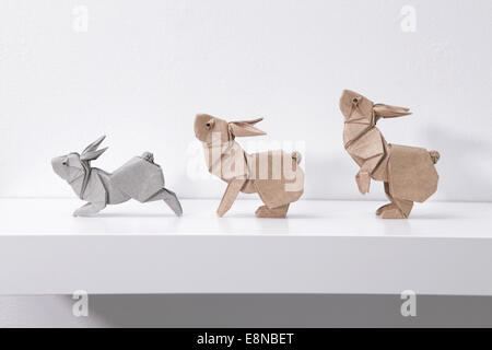Three origami Rabbits in Motion designed by Ronald Koh, Singapore Stock Photo