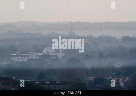 Wimbledon, London, UK. 12th October, 2014. UK weather. The Baitul Futuh mosque rises above a band of early mist covering the landscape in south west Credit:  amer ghazzal/Alamy Live News Stock Photo