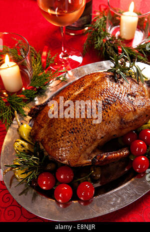 Christmas roast duck served on a festive table Stock Photo