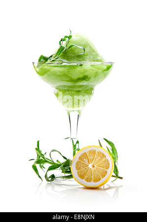 Smoothies of tarragon in a glass on a white background Stock Photo
