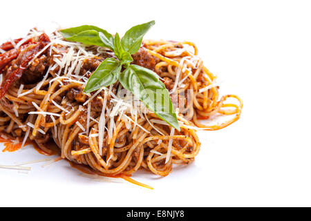 Italian pasta with sun-dried tomatoes and basil on a white background Stock Photo