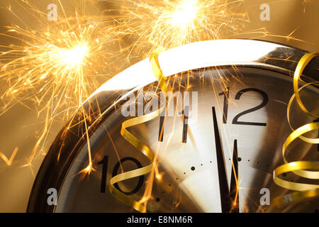 New year clock with fireworks Stock Photo